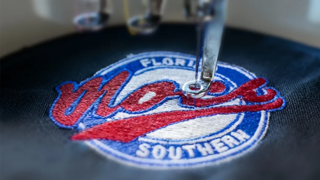 Custom DTF transfers in Austin being applied to apparel with detailed, high-quality logo printing for professional garments