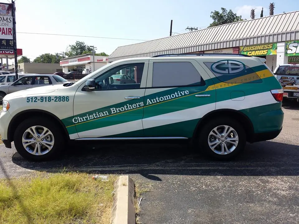 Commercial vehicle wraps Austin TX for Christian Brothers Automotive courtesy shuttle with custom vehicle graphics