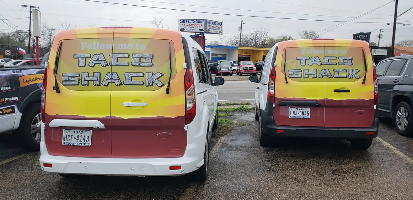 Commercial vehicle wraps Austin TX showing Taco Shack fleet vans with colorful custom vehicle wraps Austin designed for brand visibility and mobile advertising.