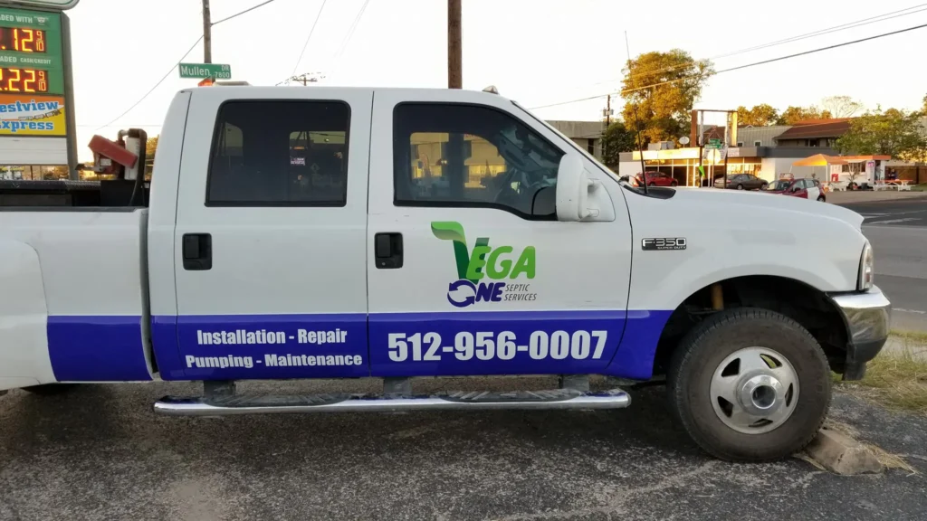 Custom commercial vehicle wraps Austin on septic service truck with branding and contact information