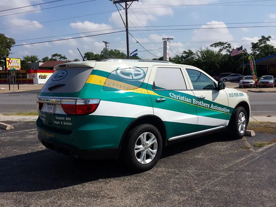 Christian Brothers Automotive commercial vehicle wrap Austin TX SUV with custom vehicle wraps Austin branding and business graphics