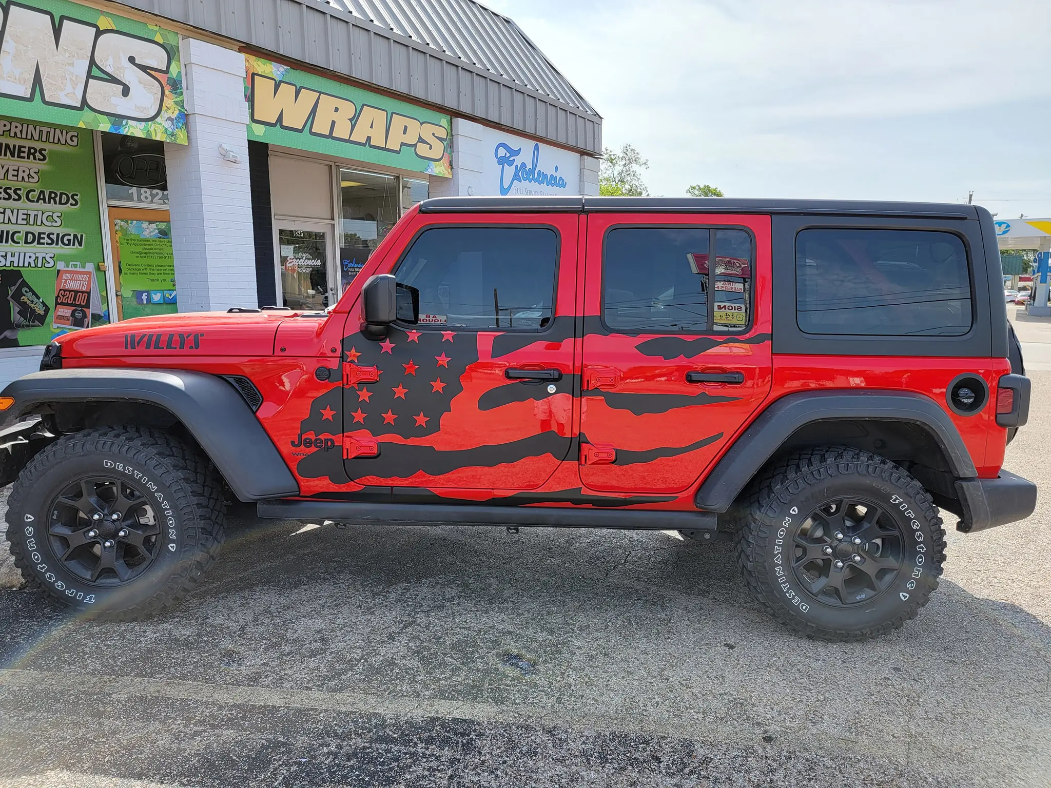 Jeep Wrangler custom vehicle wrap parked outside wrap shop in Austin Texas showing professional vinyl wrap design