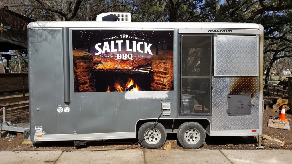 Salt Lick BBQ trailer with commercial vehicle wraps Austin TX and custom vehicle graphics branding