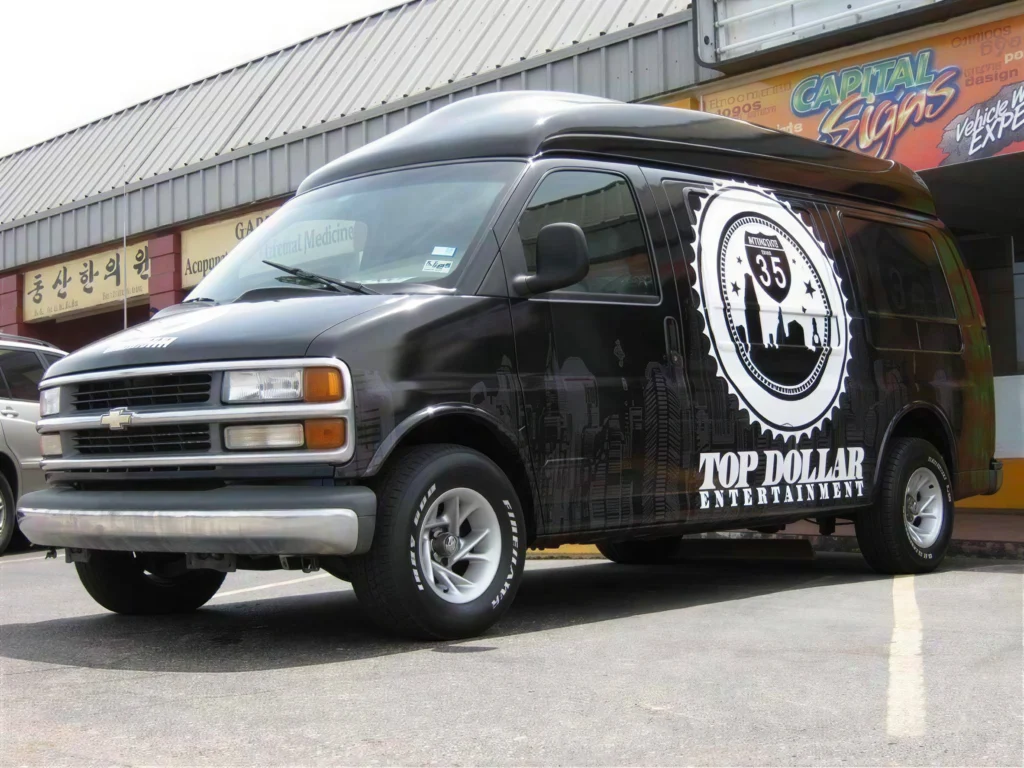 Vehicle wraps Austin TX showing Top Dollar Entertainment commercial van wrap with custom graphics and professional design