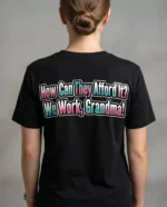 Back of black custom t-shirt with bold quote “How Can They Afford It? We Work, Grandma!” in colorful text